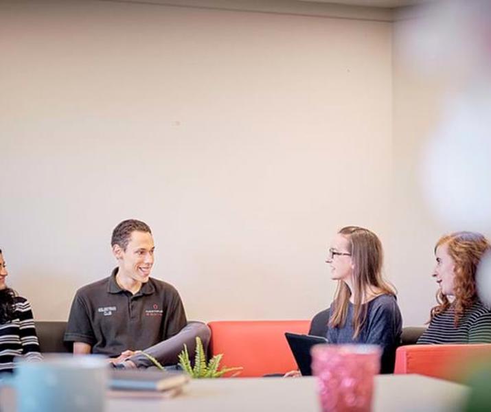 Group of students chatting in Hartpury accommodation