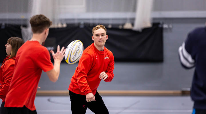 Two students taking part in sports coaching session