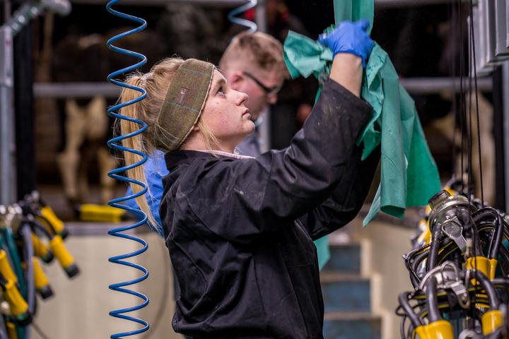 College Student In Milking Parlour
